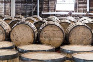 Whiskey barrel stacked in a blending room.